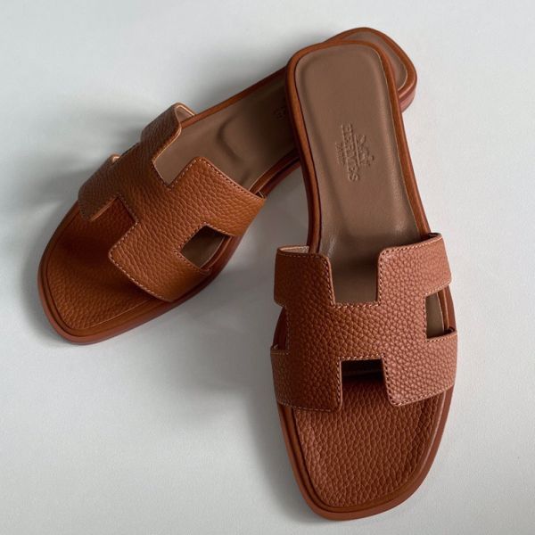 HERM Oran Slide Sandals In Gold Clemence Leather